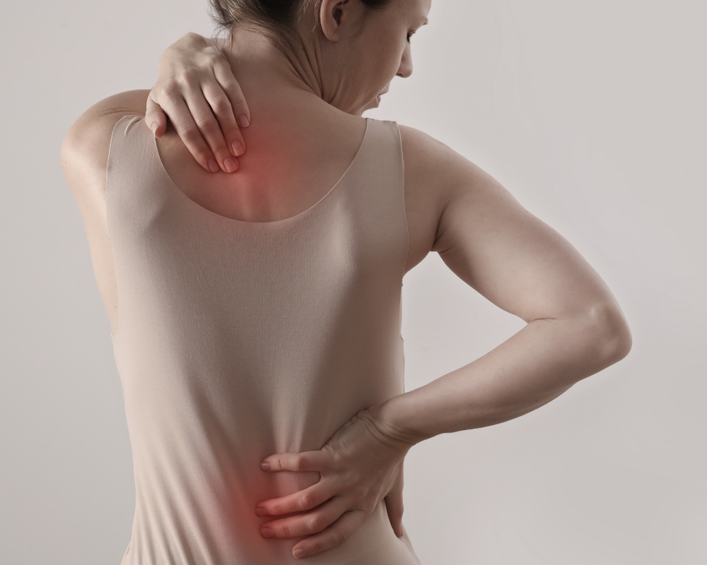 Person experiencing neck pain and back pain